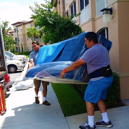 MOVERS IN HUNTERS CREEK Packed and wraped couch. 2 pro movers in orlando moving the couch.